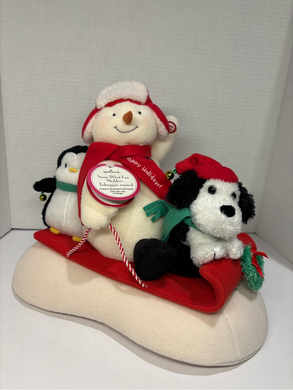 Happy Holidays Plush Snowman Sled with Penguin & Puppy - Red, White, Black
